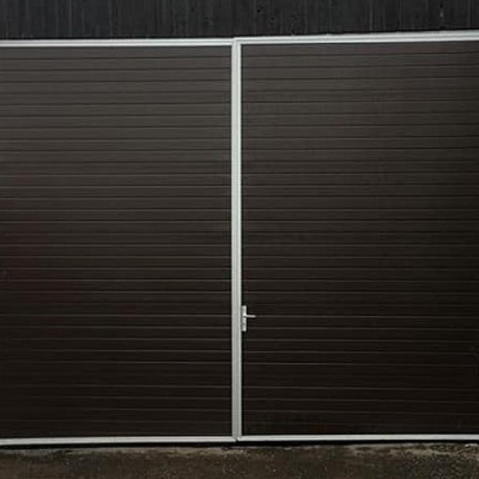 Big garage doors in dark brown colour